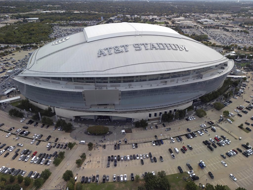 An overall aerial exterior general view of AT&T Stadium before an NFL football game between the Dallas Cowboys and the New York Giants, Sunday, Nov. 12, 2023, in Arlington, Texas. The 2026 World Cup final will be played at MetLife Stadium in East Rutherford, N.J., on July 19. FIFA made the announcement Sunday, Feb. 4, 2024, at a Miami television studio, allocating the opener of the 39-day tournament to Mexico City’s Estadio Azteca on June 11. Semifinals will be played on July 14 at AT&T Stadium in Arlington, Texas, and the following day at Mercedes Benz Stadium in Atlanta. (AP Photo/Tyler Kaufman)
