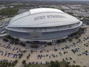 An overall aerial exterior general view of AT&T Stadium before an NFL football game between the Dallas Cowboys and the New York Giants, Sunday, Nov. 12, 2023, in Arlington, Texas. The 2026 World Cup final will be played at MetLife Stadium in East Rutherford, N.J., on July 19. FIFA made the announcement Sunday, Feb. 4, 2024, at a Miami television studio, allocating the opener of the 39-day tournament to Mexico City’s Estadio Azteca on June 11. Semifinals will be played on July 14 at AT&T Stadium in Arlington, Texas, and the following day at Mercedes Benz Stadium in Atlanta. (AP Photo/Tyler Kaufman)