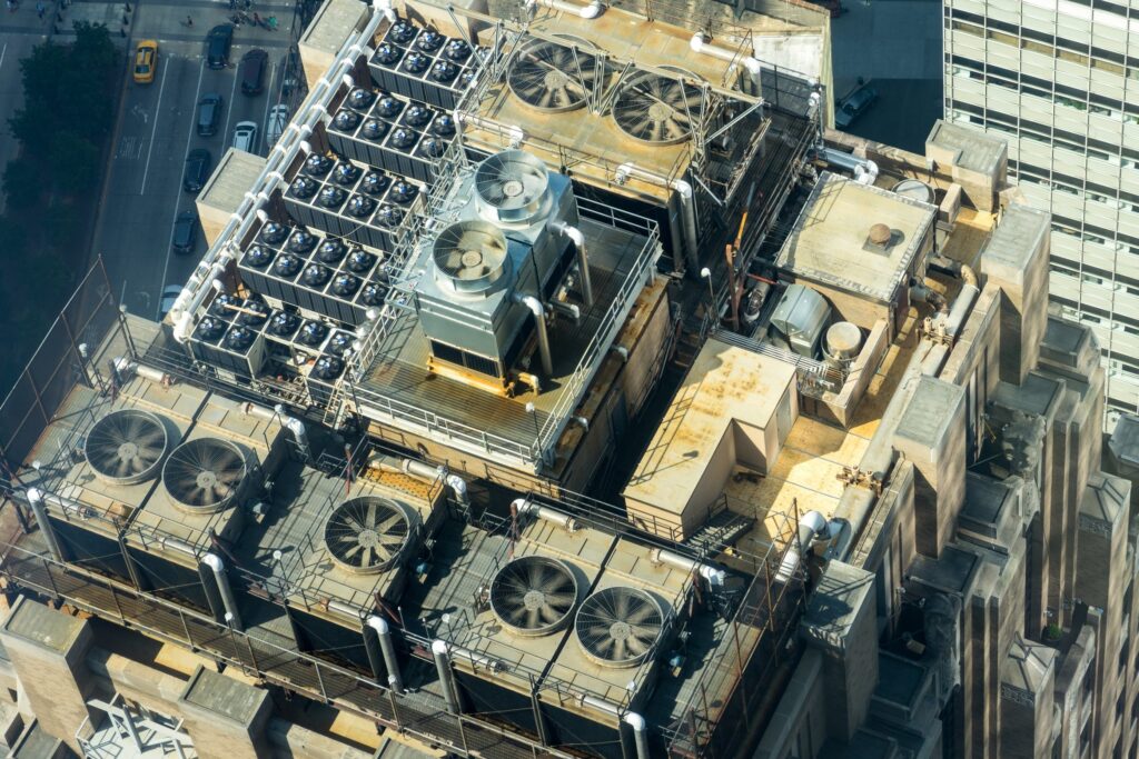 An aerial photograph of HVAC systems installed on the top of a large skyscraper