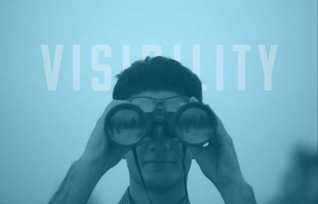 Man using binoculars beneath the word “VISIBILITY”
