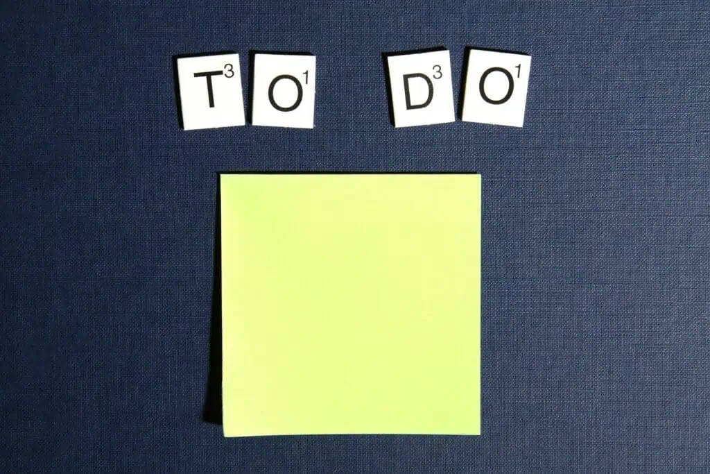 Letter tiles spelling "TO DO" above yellow sticky note