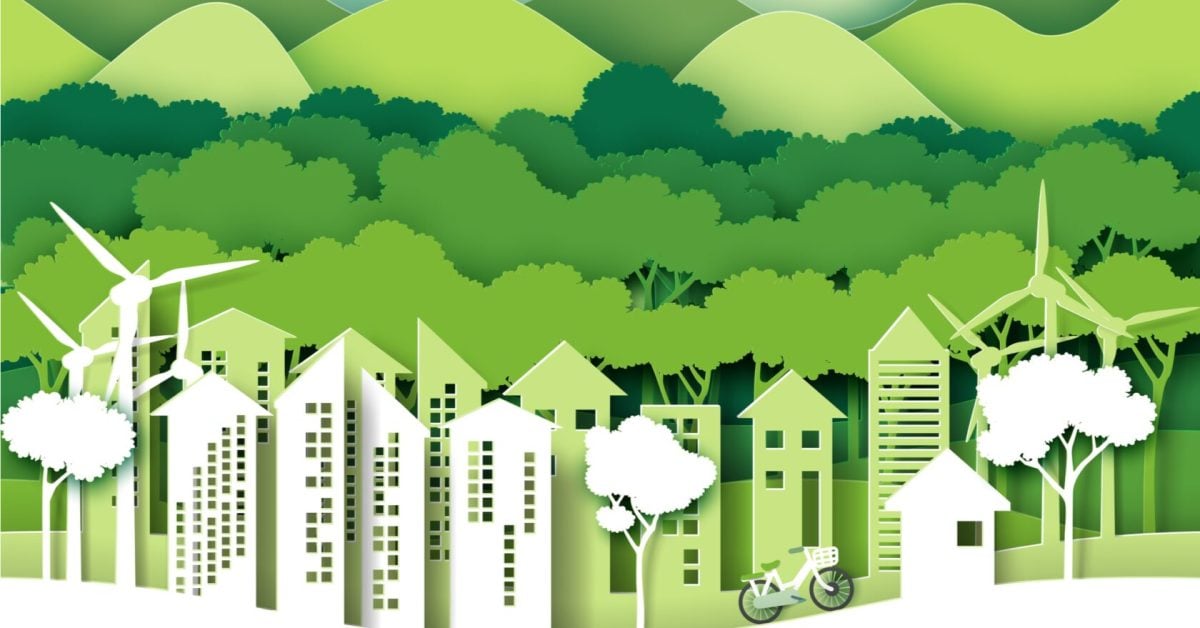 A creative illustration of tall buildings and wind turbines set in front of some green forests and mountains.