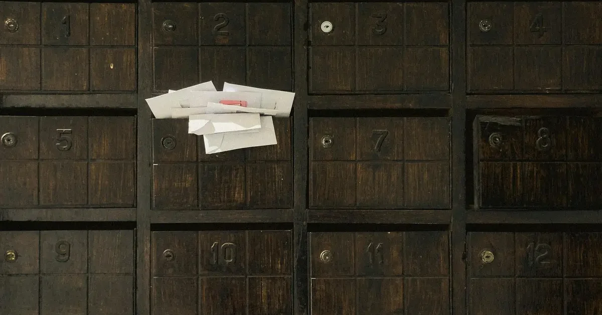 Photo of vintage wooden mailboxes.