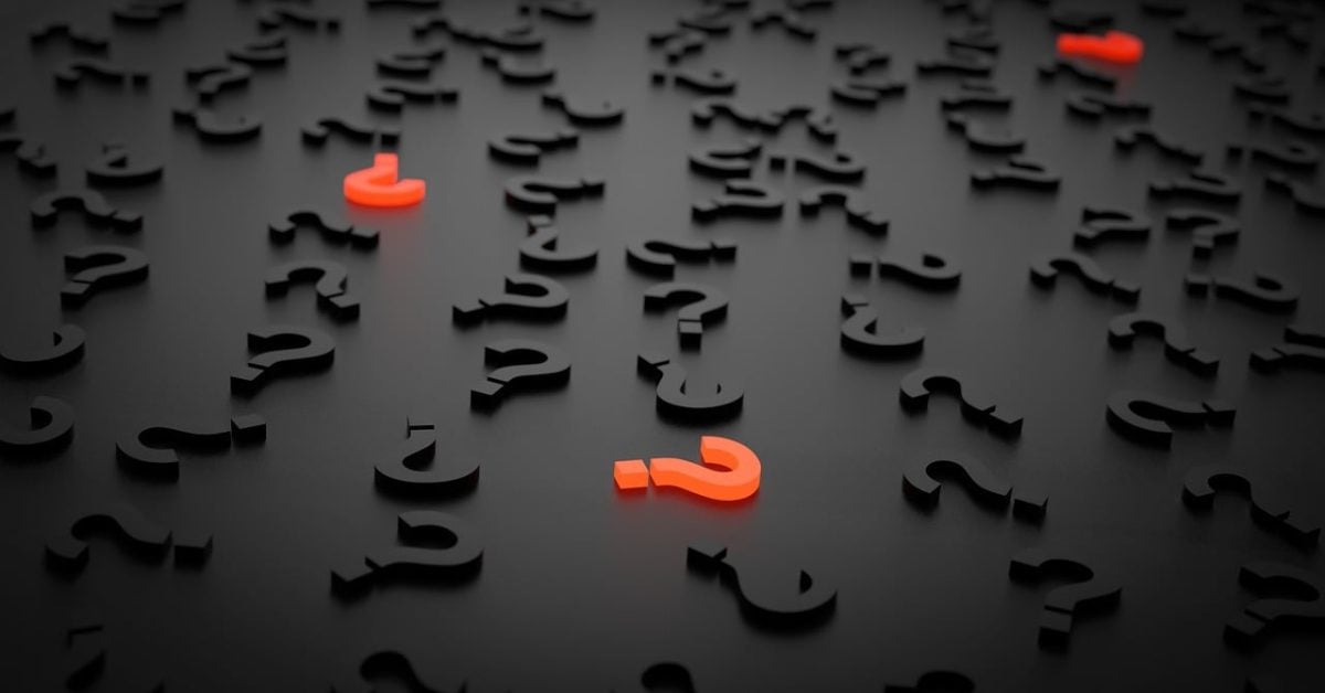 Black and red question marks litter a black table.